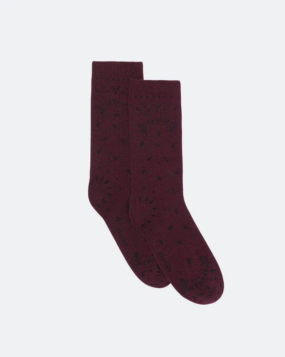 A pair of dark burgundy crew socks with a subtle black knit pattern, displayed against a light gray background.