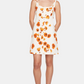 Woman wearing a floral dress with orange flowers on a white background