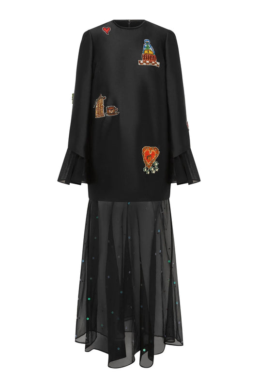 Black dress with colorful patches on a white background