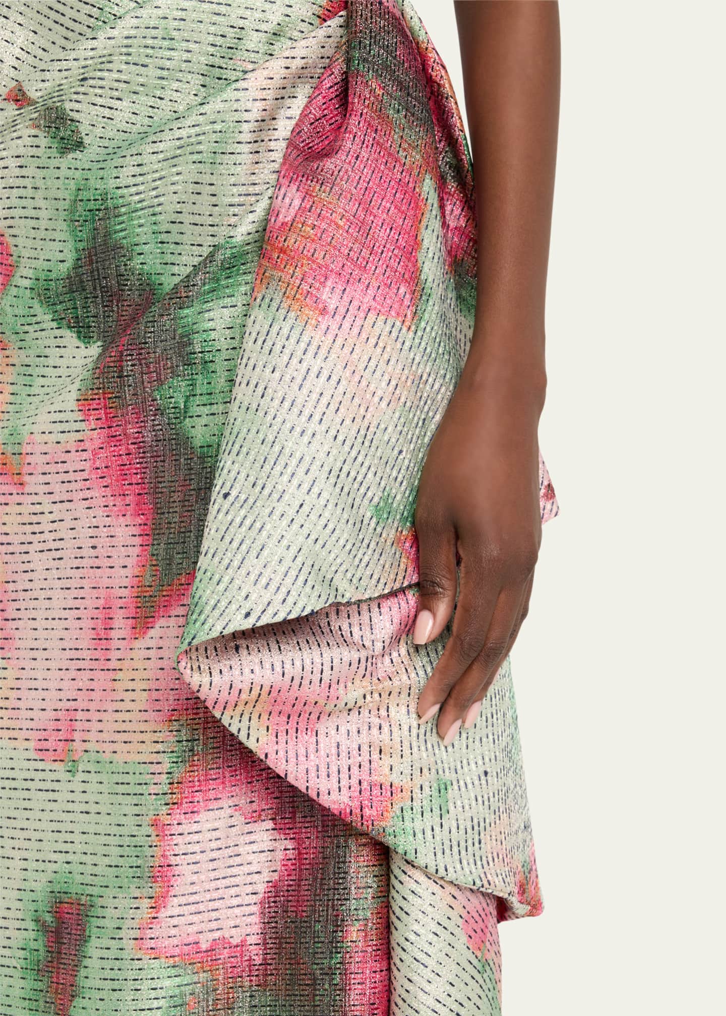 Close-up of a floral patterned fabric with pink and green colors.