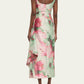 Woman wearing a floral dress with a white background